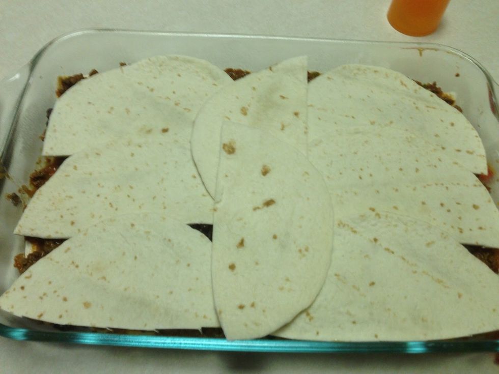 Add more tortilla half circles.