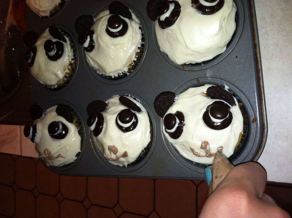 Add mouths with chocolate frosting