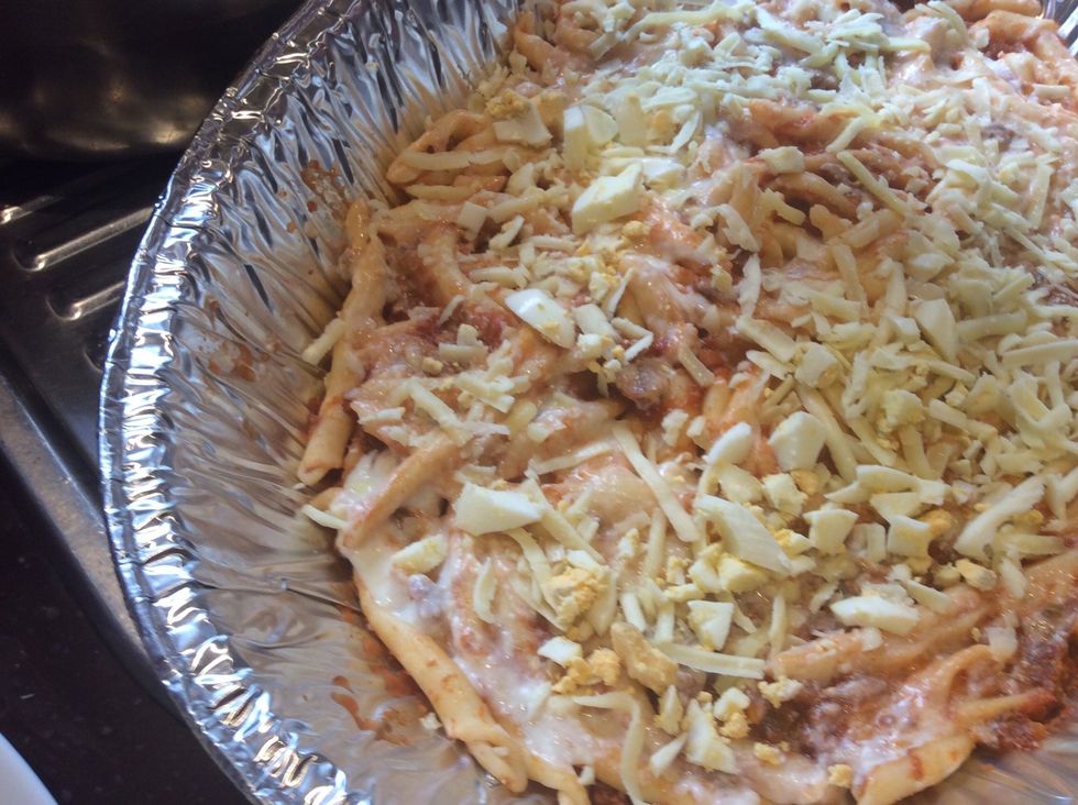 Add mozzarella and boiled egg ontop. Spread evenly. Repeat steps 16-19 once more.