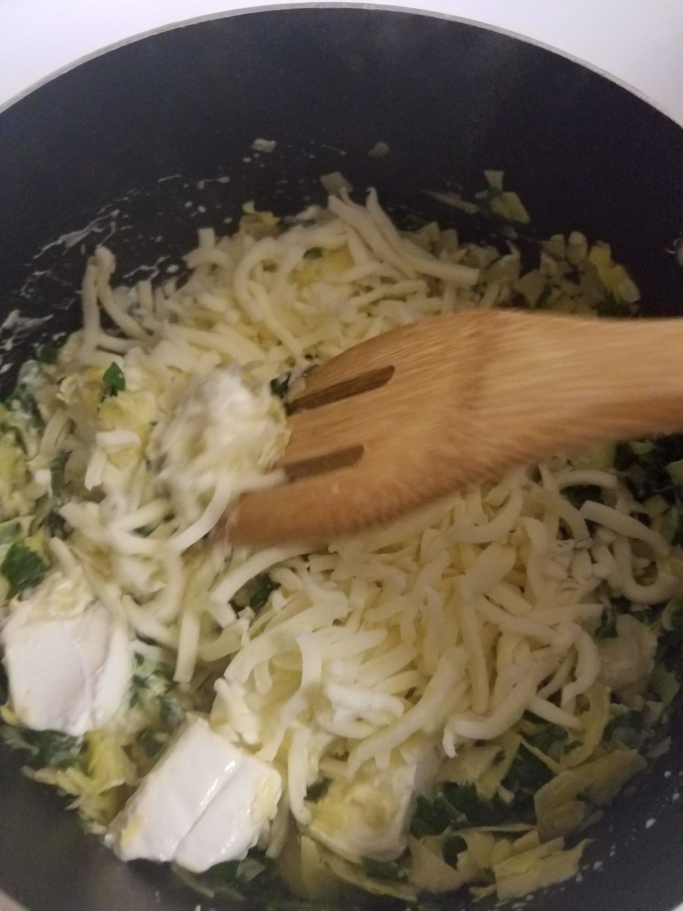Add mozzarella, and let it melt entirely. Season with salt and pepper to taste.