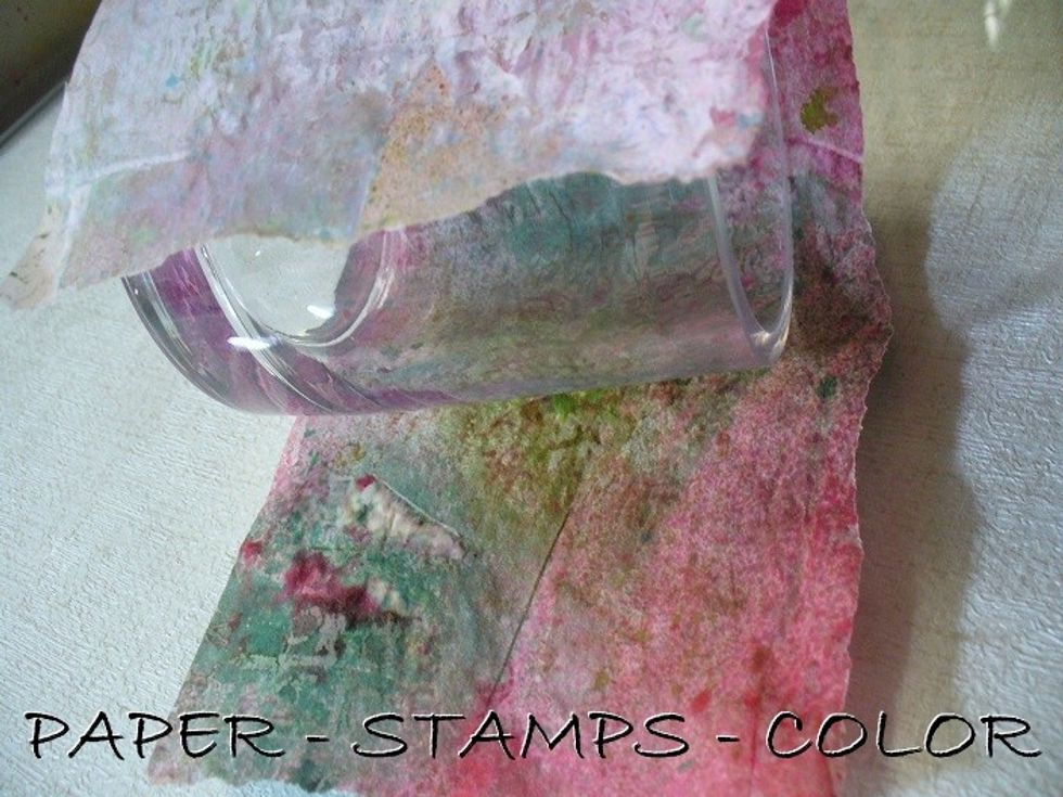 Add multi medium thinly to the paper and glass. Adhere it to the holder. Remove air bubbles; it's very fragile, so be careful with it. Dry it first if there's any loose ends; then add new medium.