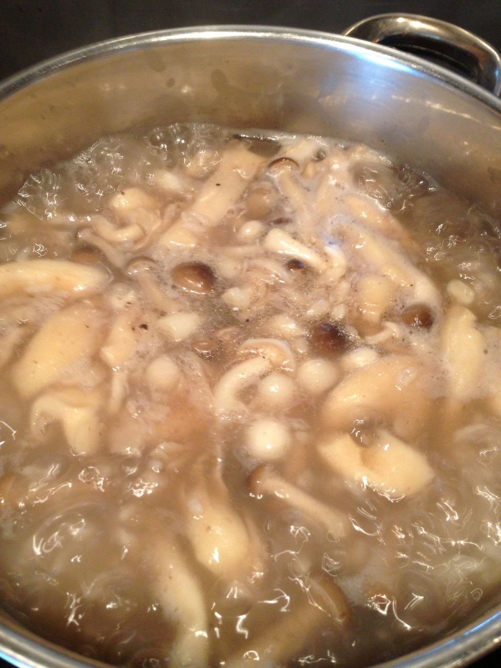 Add mushroom into the boiling rice