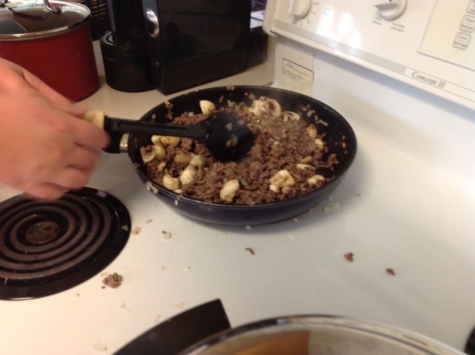Add mushrooms and onions to hamburger.