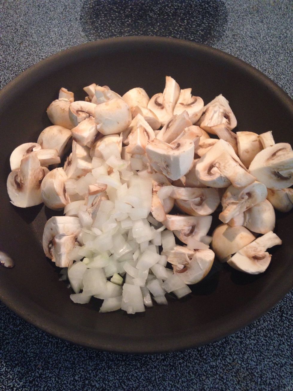 Add mushrooms and onions to heated oil. Stir frequently while cooking.