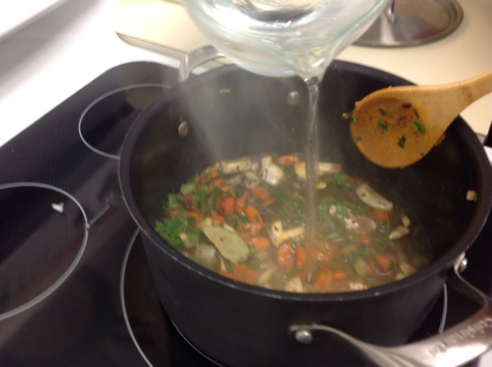Add mushrooms, Rosemary, thyme, peppercorns, bay leaves, parsley, and water.