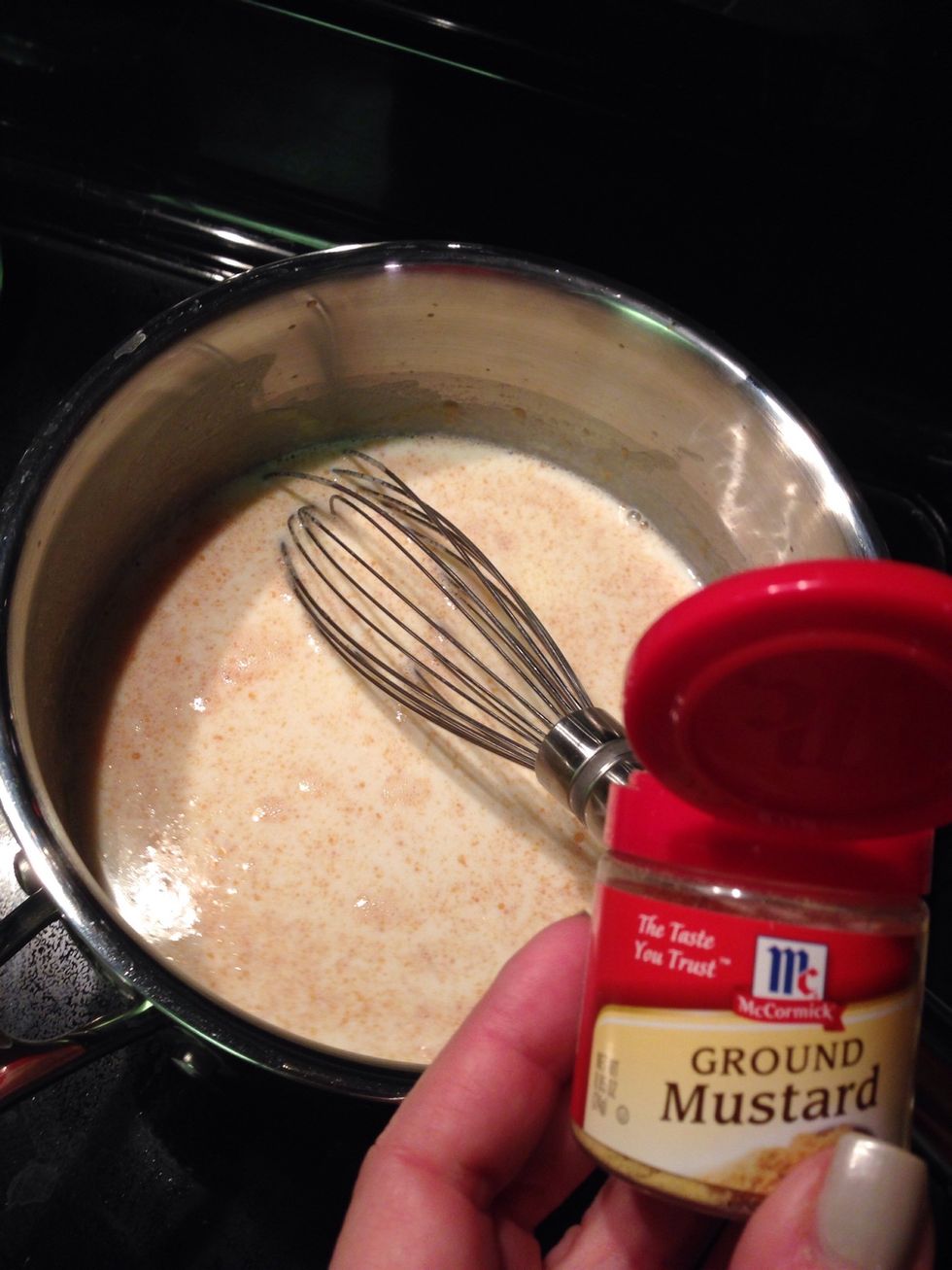 Add mustard and milk. Whisk until smooth.