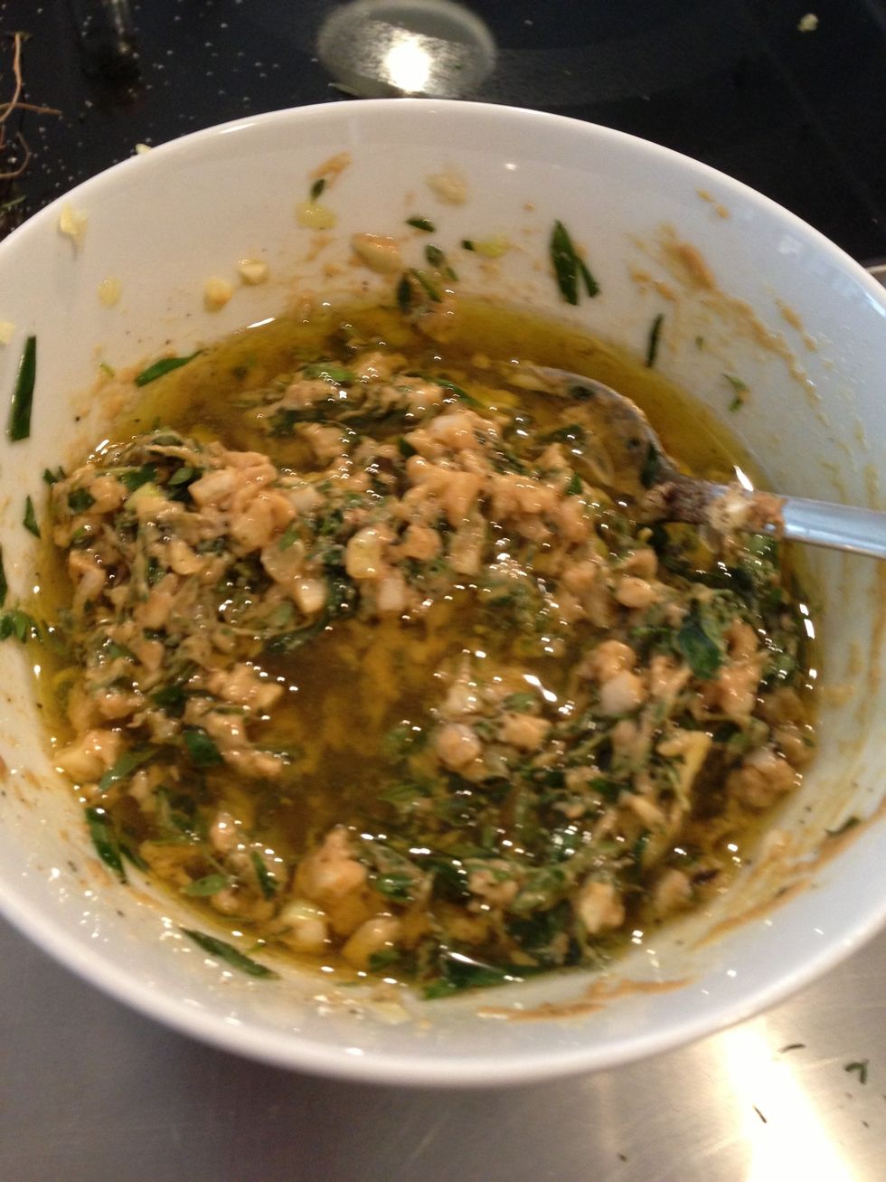 Add mustard, garlic, salt, pepper, enough oil to form a paste