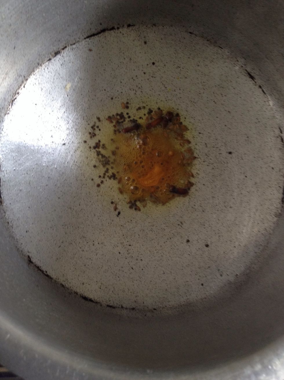 Add mustard seeds and let it all pop. Add clove, asafoetida and turmeric. (Keep d flame on low heat else it will all burn quick.)
