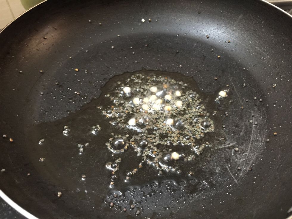 Add mustard seeds and then urad dal