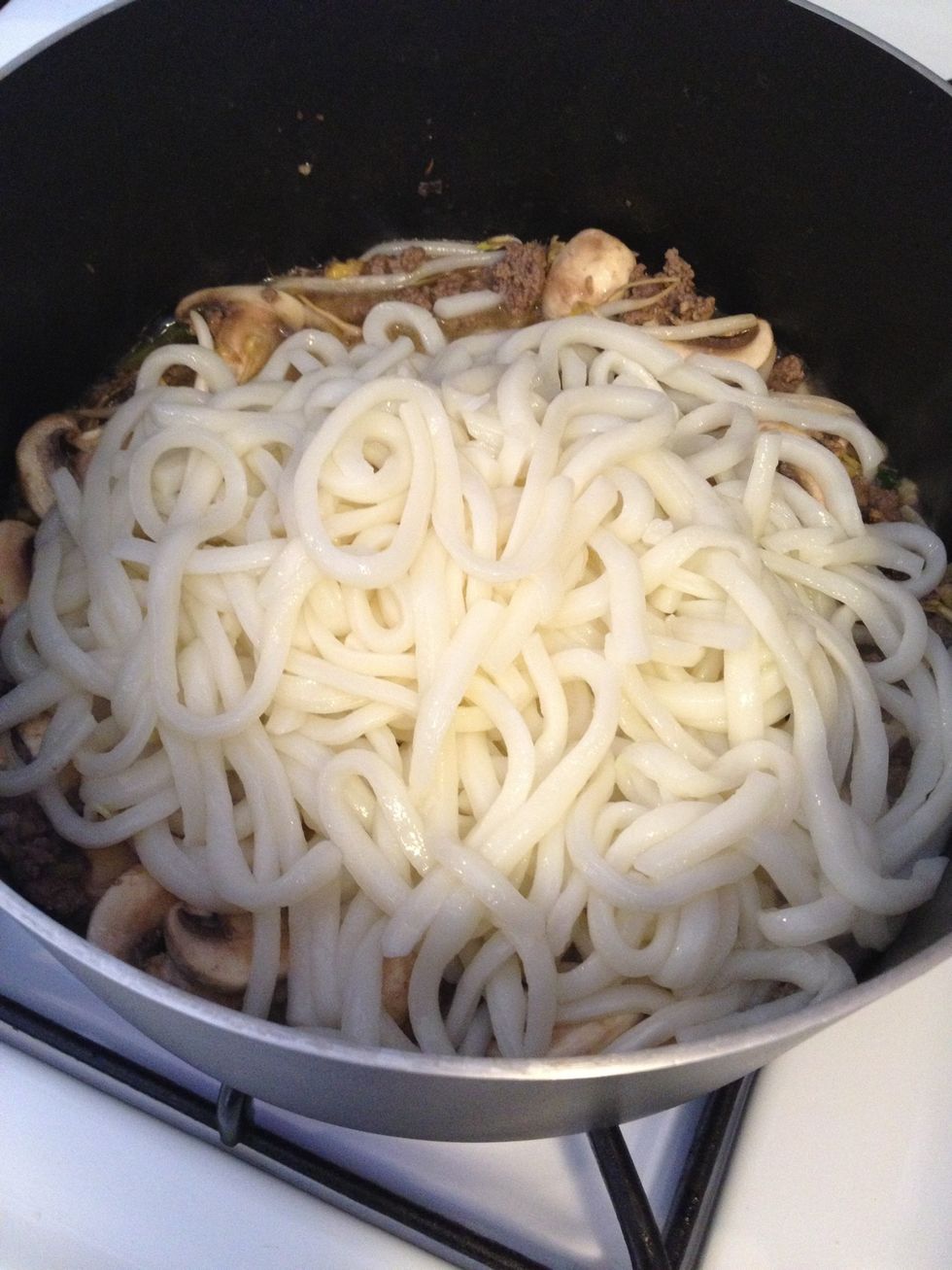 Add noodle and 2 more tea spoons of soy sauce mix it around.