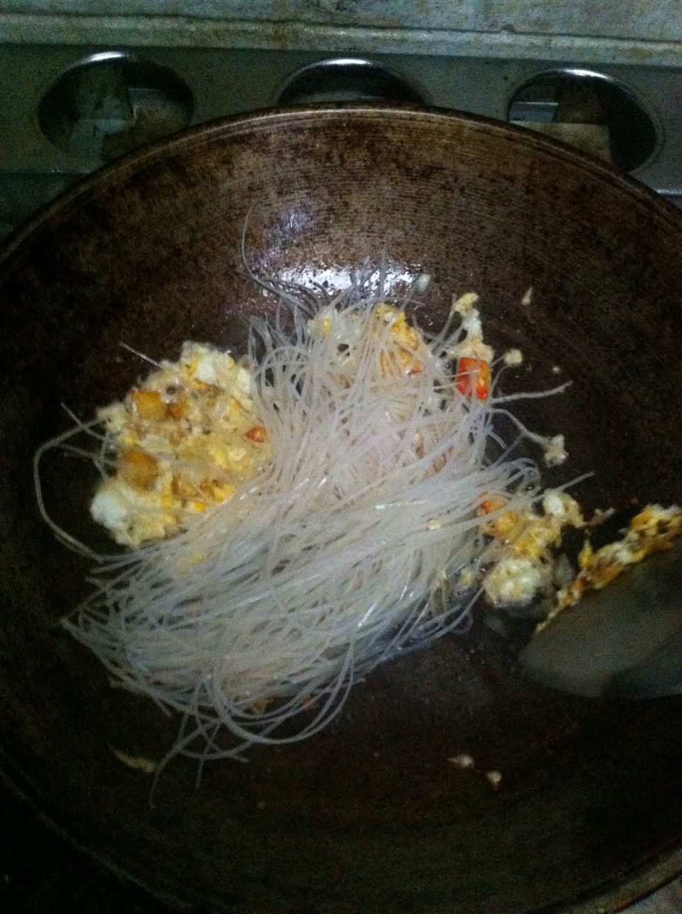 Add noodle stir-fired with 1 tsp water.