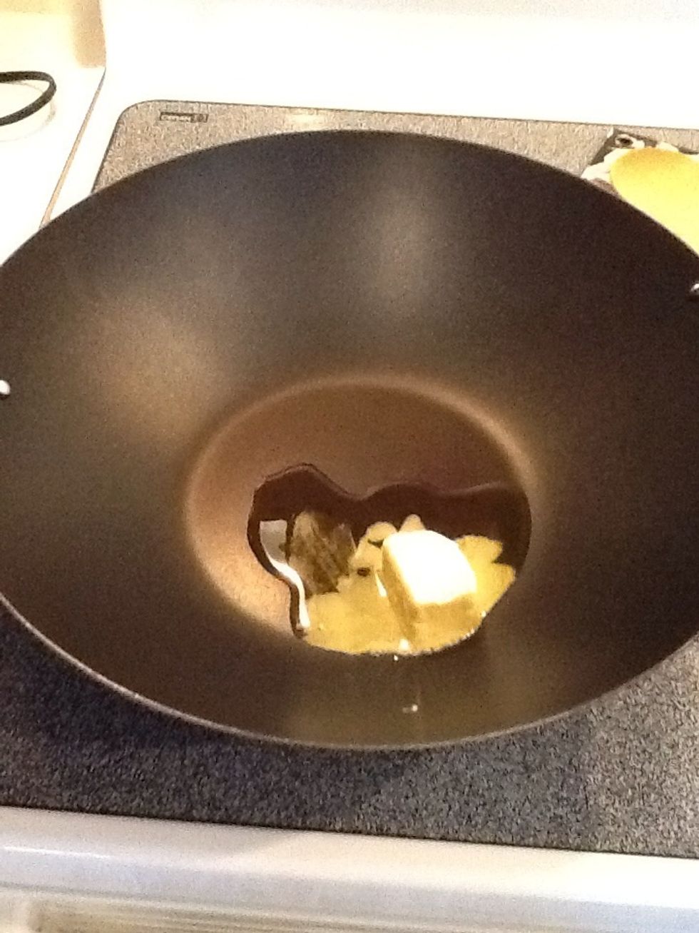 Add oil and butter to large saucepan or wok. Melt butter over medium heat.