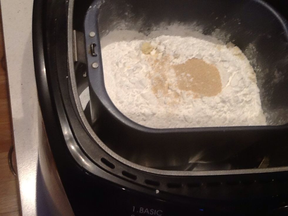 Add oil, flours and yeast as directed by your machine.