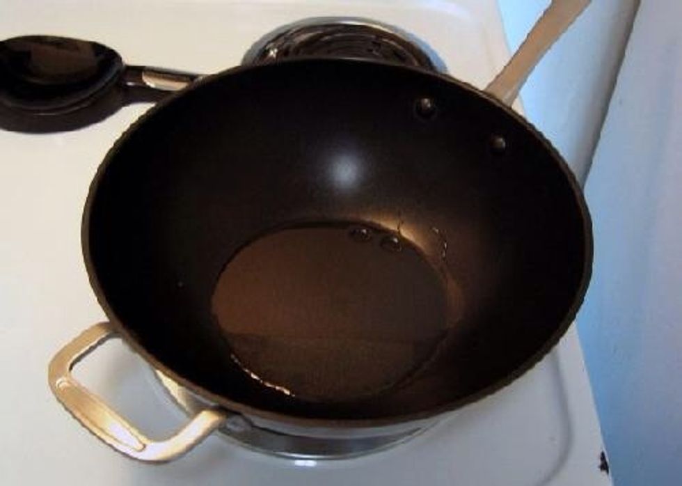 Add oil into wok and put the flame to high