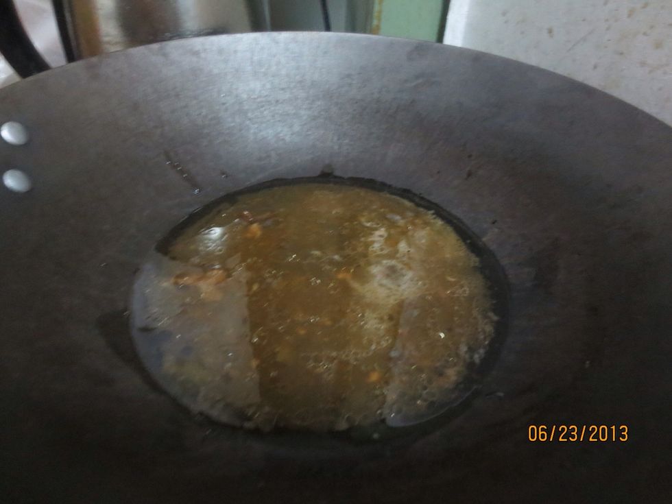 Add oil , soy sauce and a bit of sesame oil to wok