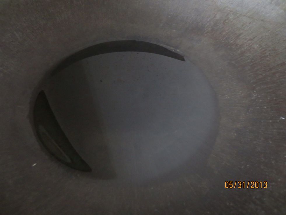 Add oil to wok and heat until bubbles form