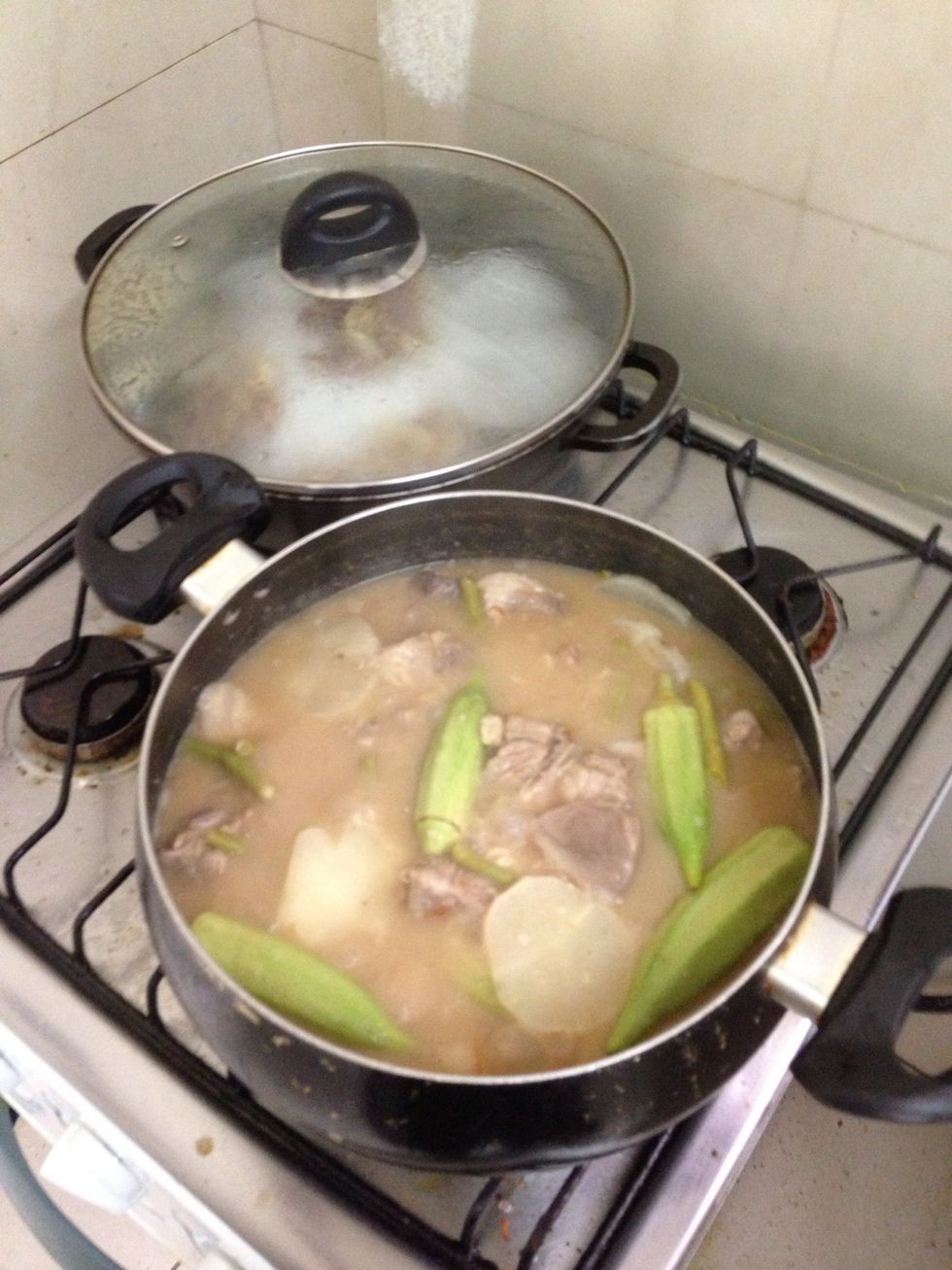 Add okra and siling labuyo. Also add the string beans.