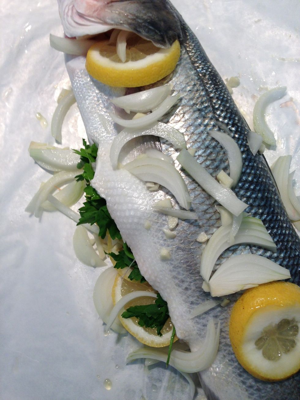 Add olive oil a bit of water and grill in a preheated oven 200 C . 35 mins for this one. It depends on the size of the fish and on your oven