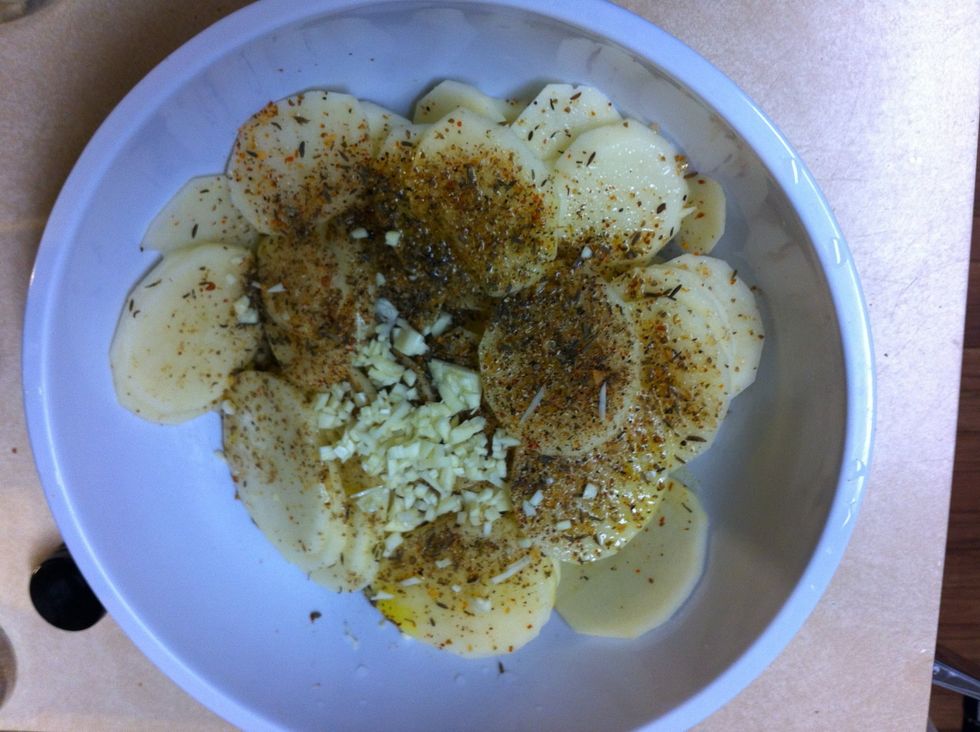 Add olive oil, garlic and spices.