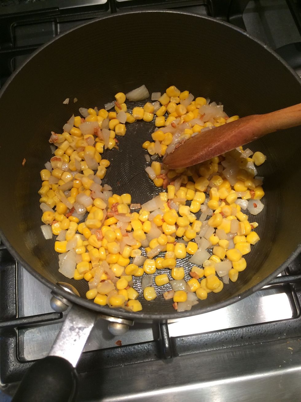 Add olive oil. Let heat & add garlic, let cook and add onions and Sweetcorn