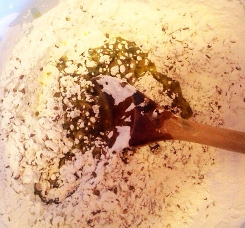 Add olive oil. Stir and add the boiling water.