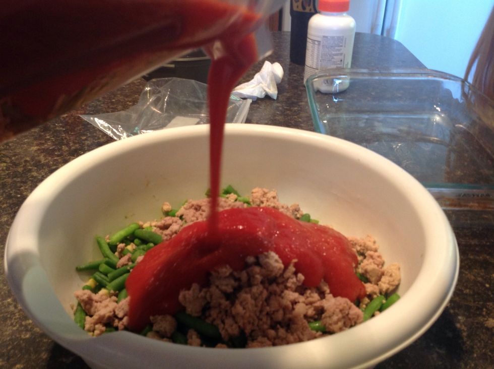 Add one 42 ounce can of tomato soup. And preheat the oven to 375.