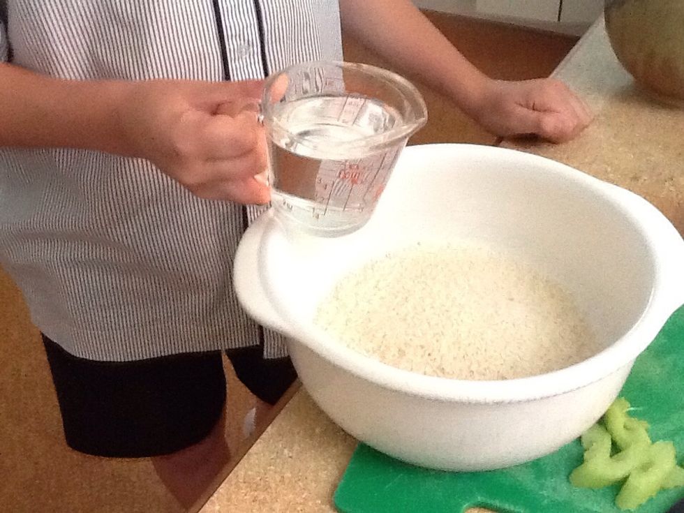 Add one and a half cups of water to the rice.