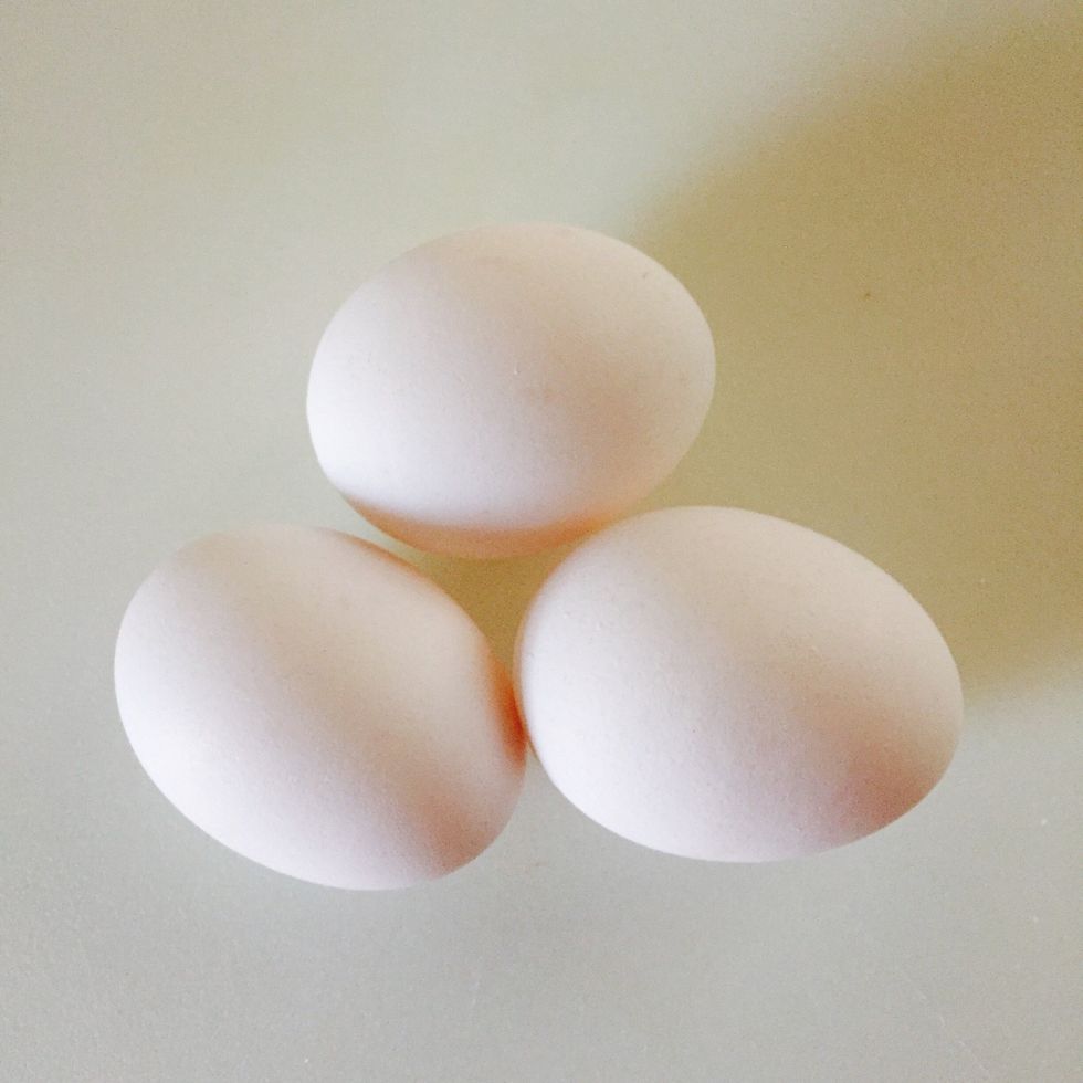 Add one beaten egg at a time for a total of three eggs for a moist cake. Use fewer or no eggs if desired.