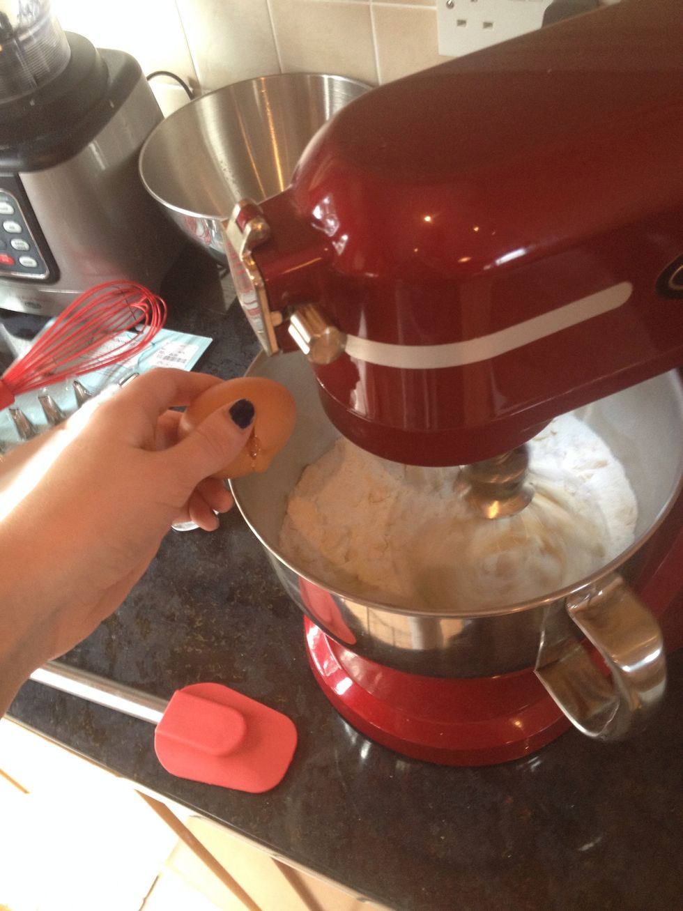 Add one egg at a time as the mixture slowly combines together.