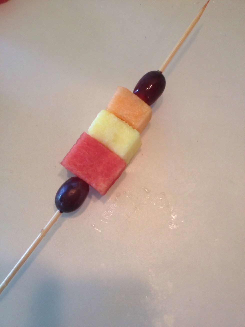 Add one grape to each end.