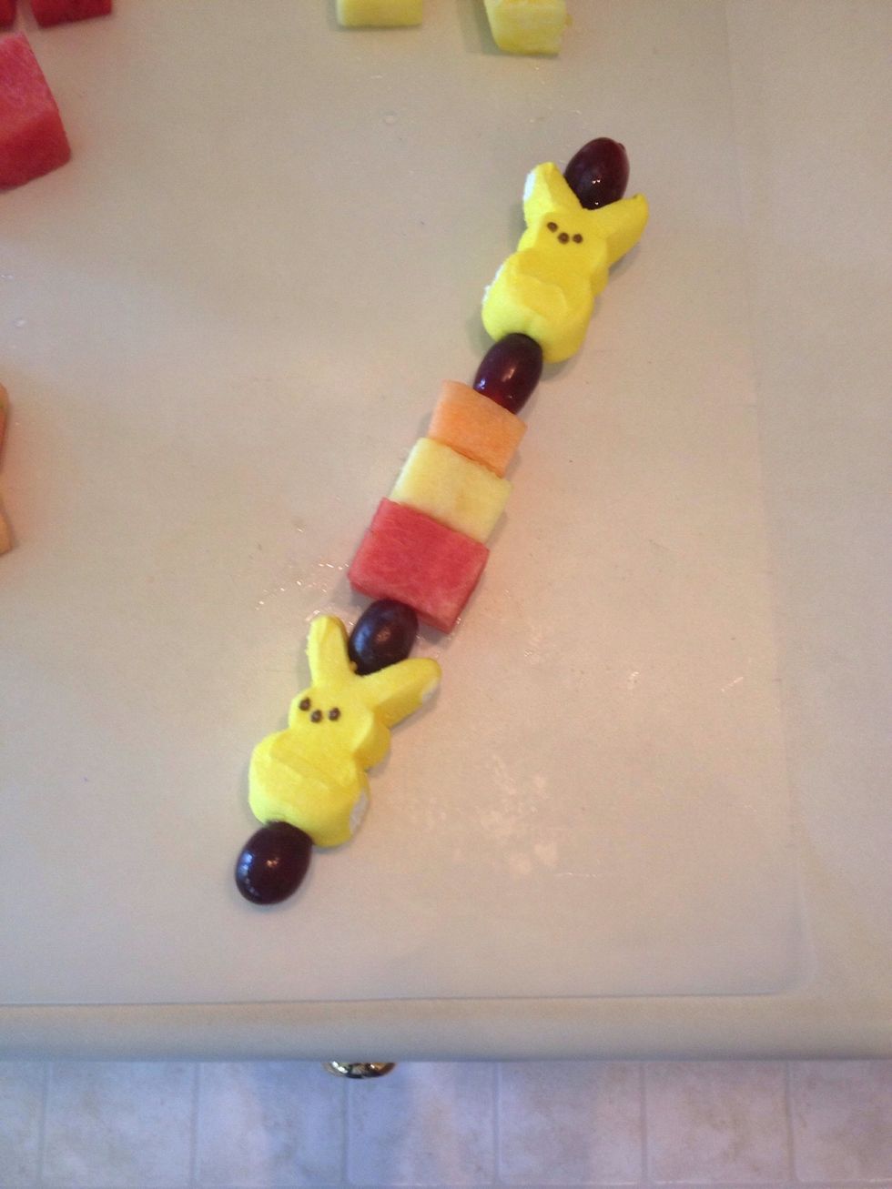 Add one grape to each end.