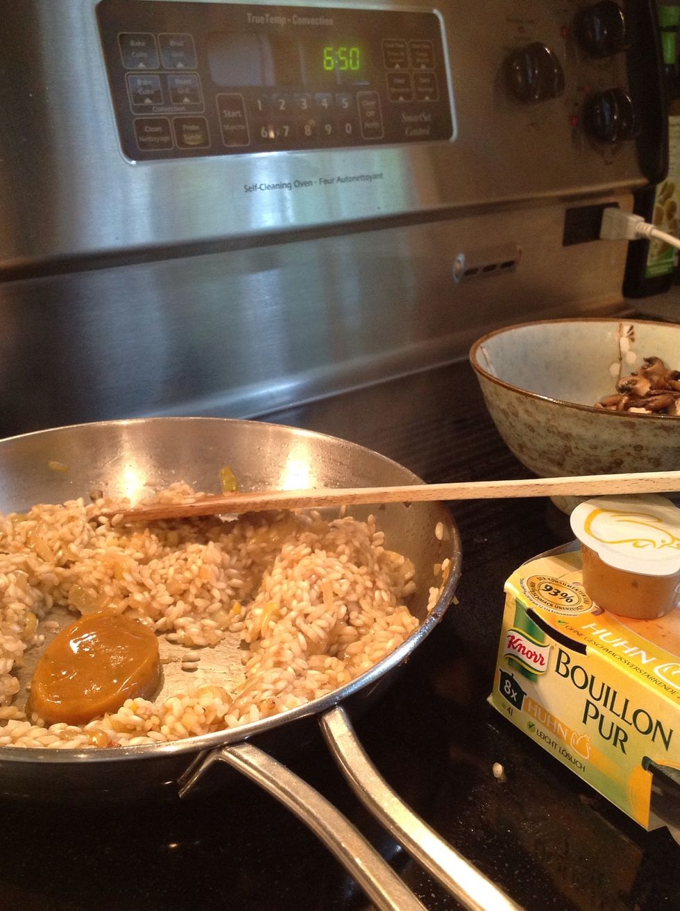 Add one Knorr Homestyle stock cube, and half a cup of boiling water. Now: pay attention! Keep adding half a cup of water at a time, stirring until its absorbed. Continue until rice is cooked.