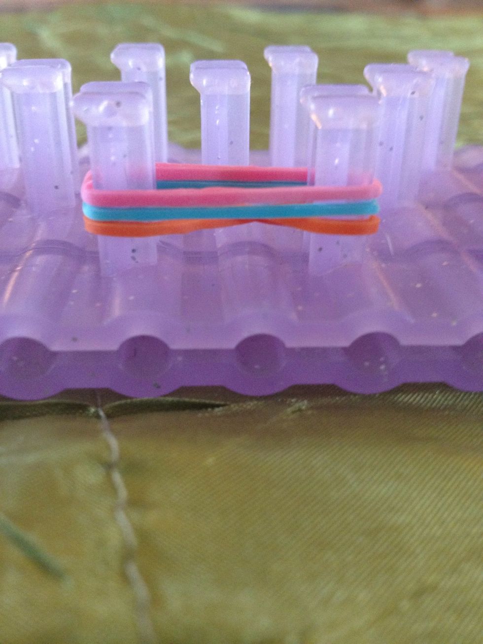 Add one more untwisted. You want to keep three bands on the loom at all times while making this, no more, no less.