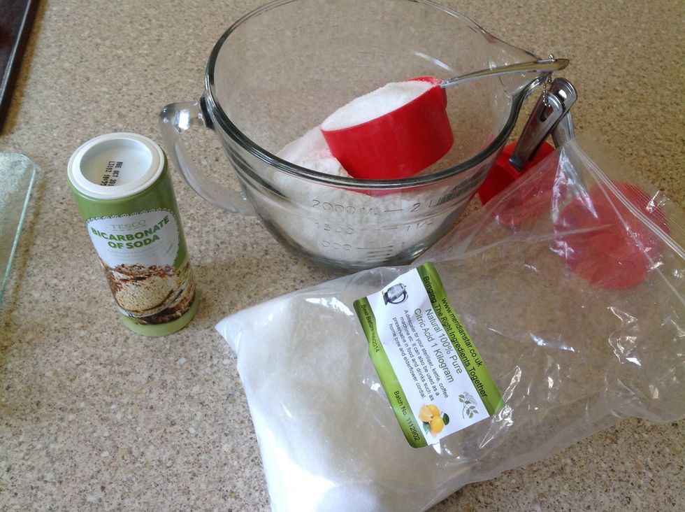 Add one part critic acid to two parts bicarbonate soda. I've used one cup of citric acid and two cups of bicarbonate soda.