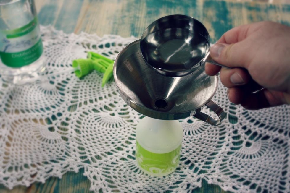 Add one part vinegar. Vinegar is a mild acid, and is what will remove the grime. Either fill the container half full or use the same measuring cup for both ingredients.