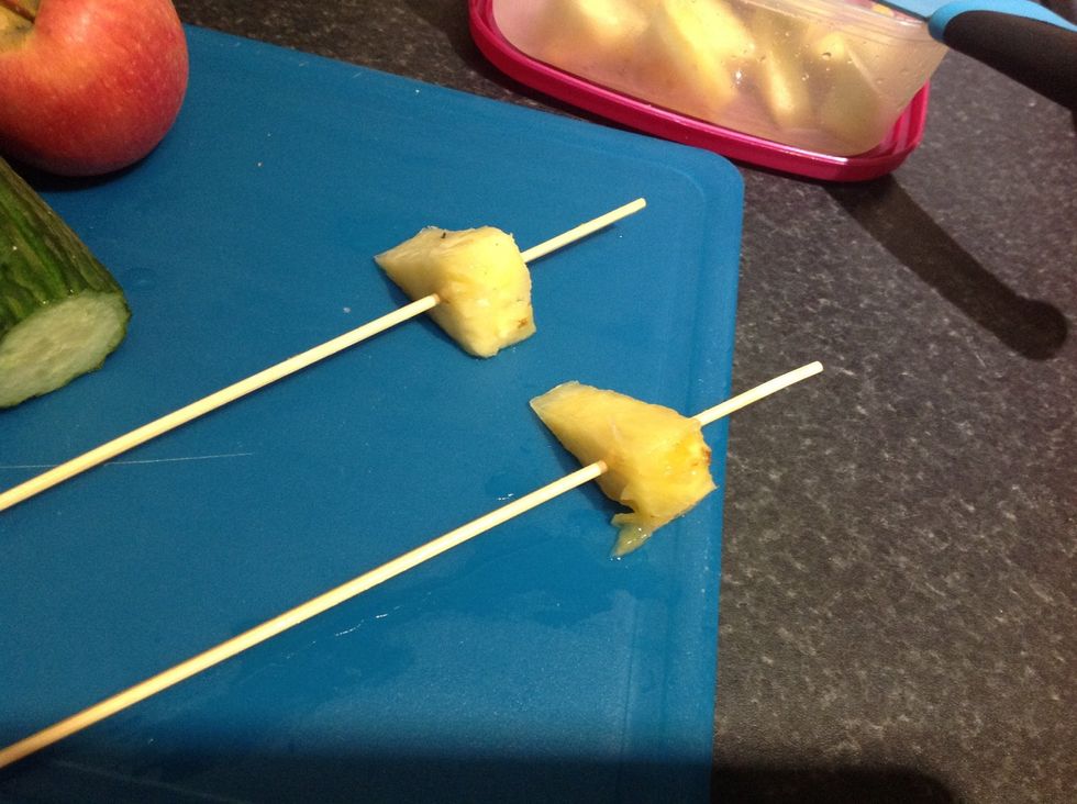 Add one piece of pineapple to the top