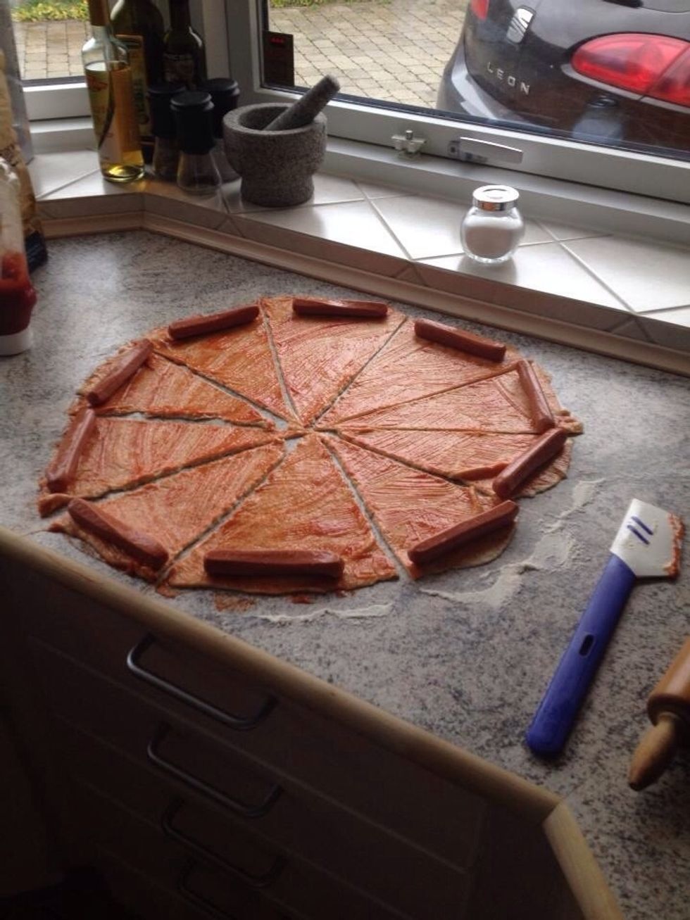 Add one sausages to each triangle