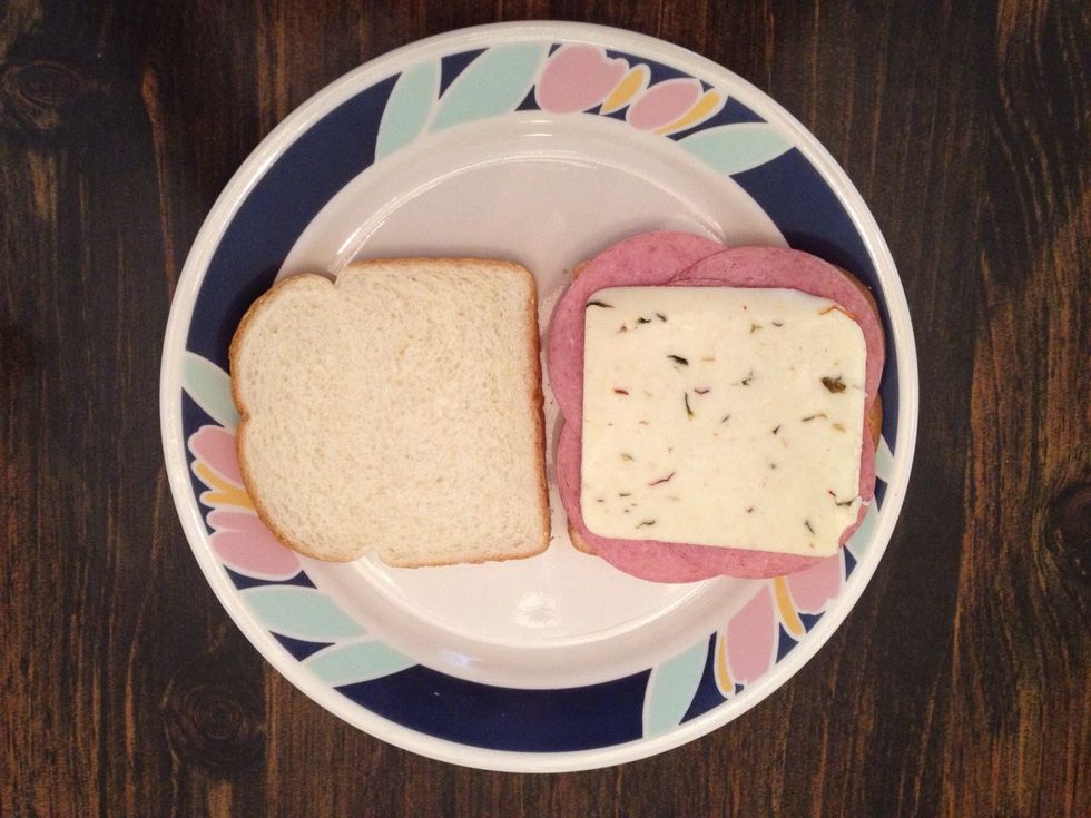 Add one slice of pepper jack cheese...