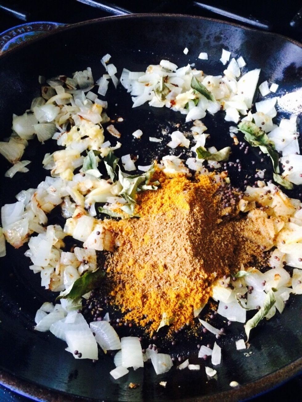 Add one table spoon of cumin, 2 tablespoons curry power, handful of mustard leaves and two curry leaves, salt and chile to taste