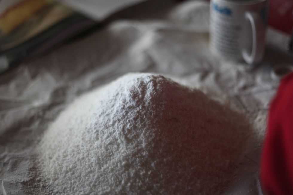 Add one tablespoon of baking powder to the flour and coconut mix.