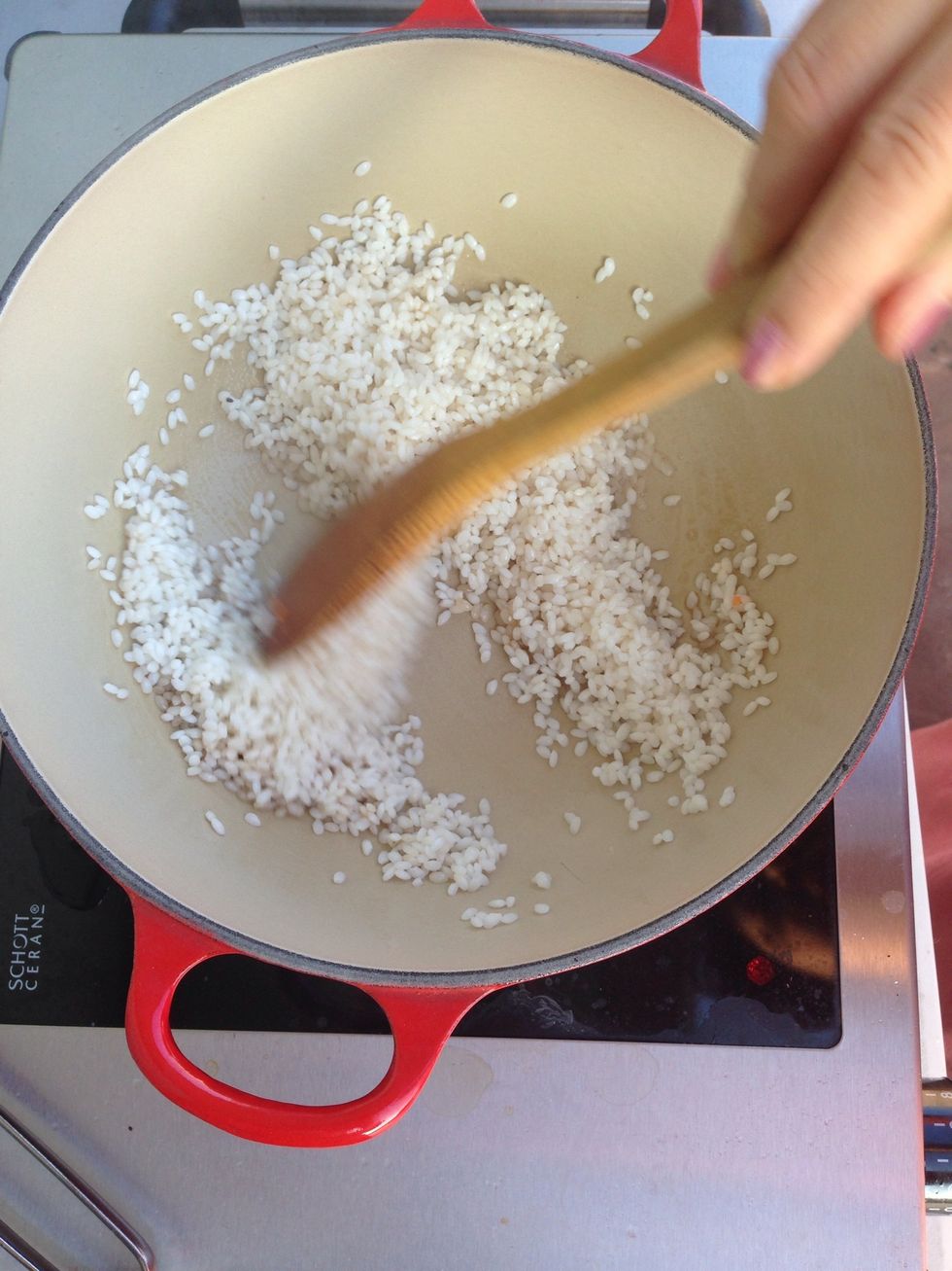 Add one tablespoon of sesame oil to a large casserole pot. Add in washed white rice (can be done with brown rice). Make sure to soak the rice overnight to help it soften for quicker cooking.