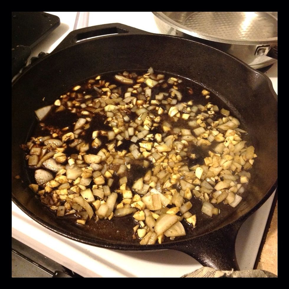 Add onion and garlic to hot skillet with oil.