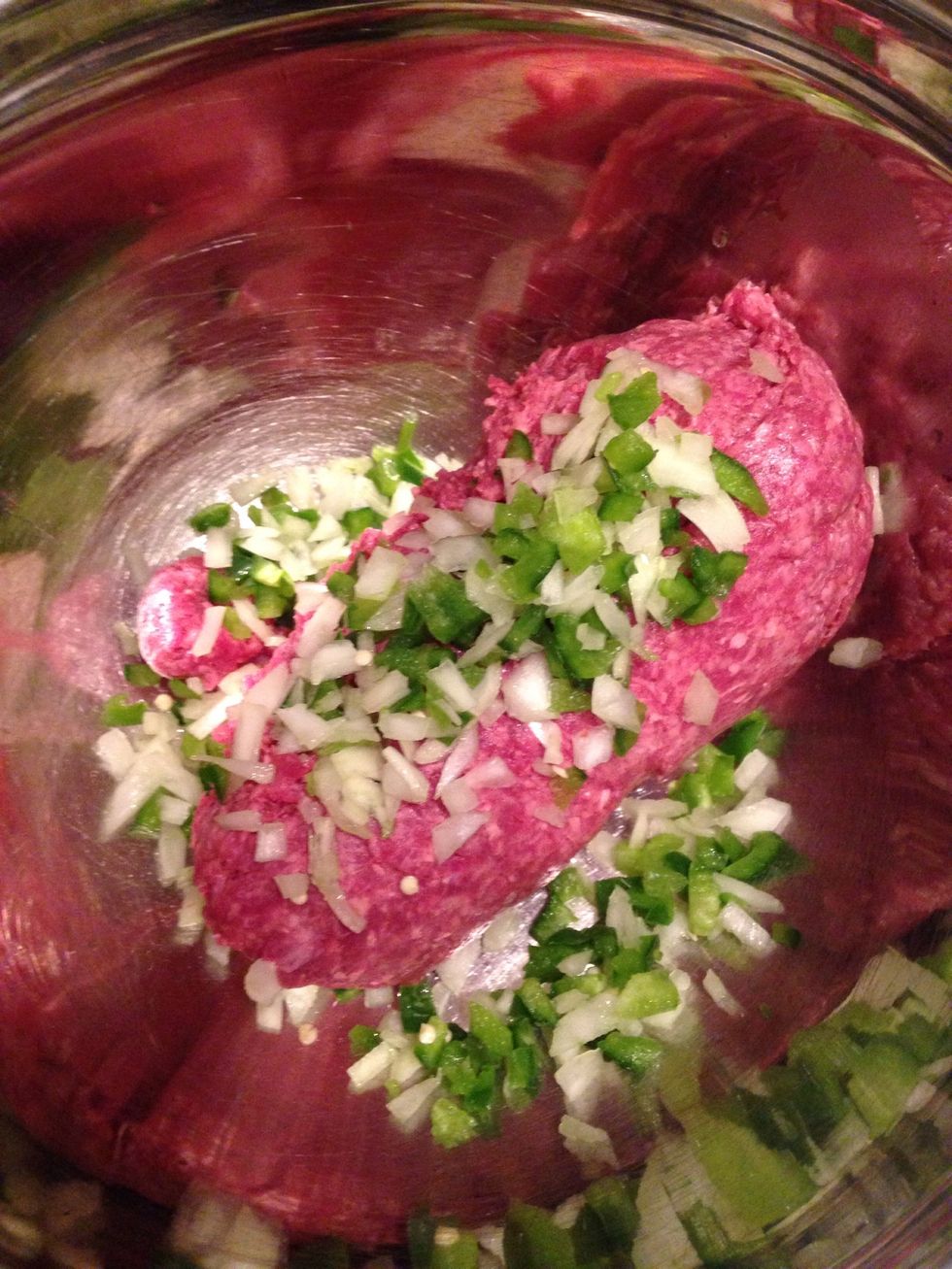 Add onion and green peppers to ground beef