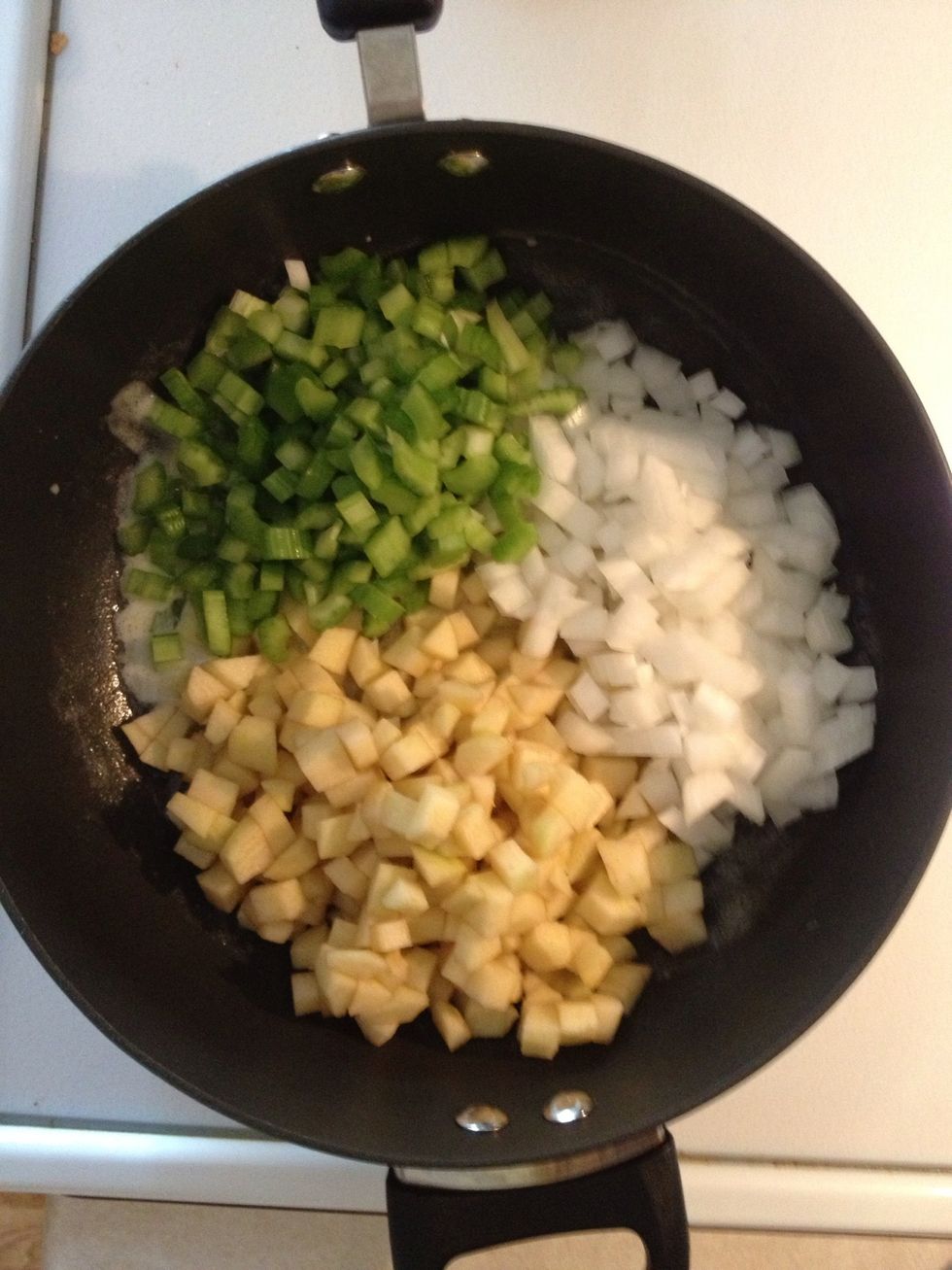 Add onion, apple, and celery. Cook until onion softens.