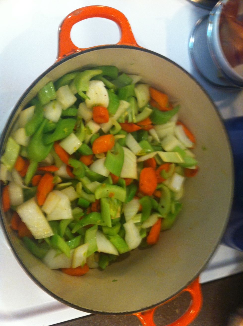 Add onion, celery, and garlic. Saut\u00e9 for 10 minutes over medium-high heat.