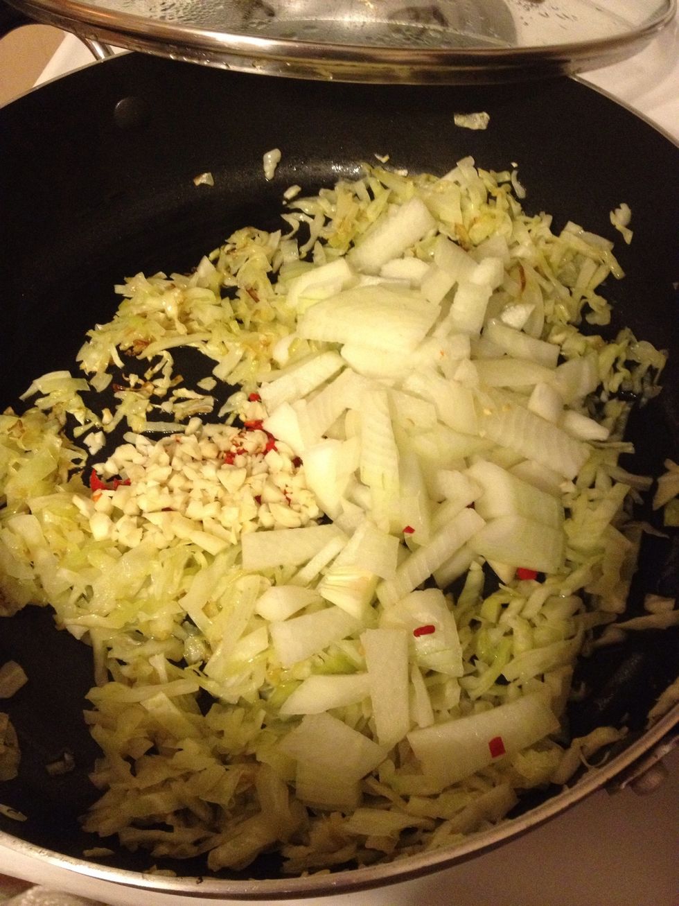 Add onion, garlic, & hot pepper to the pan.