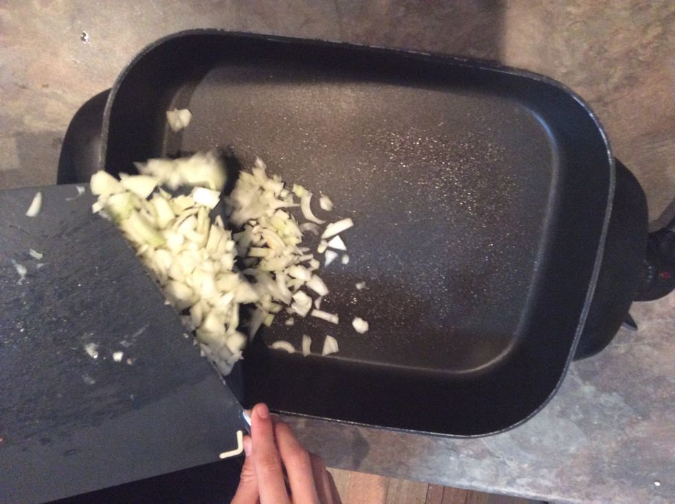 Add onion to moderate heat electric fry pan (spray of rice bran oil is optional)