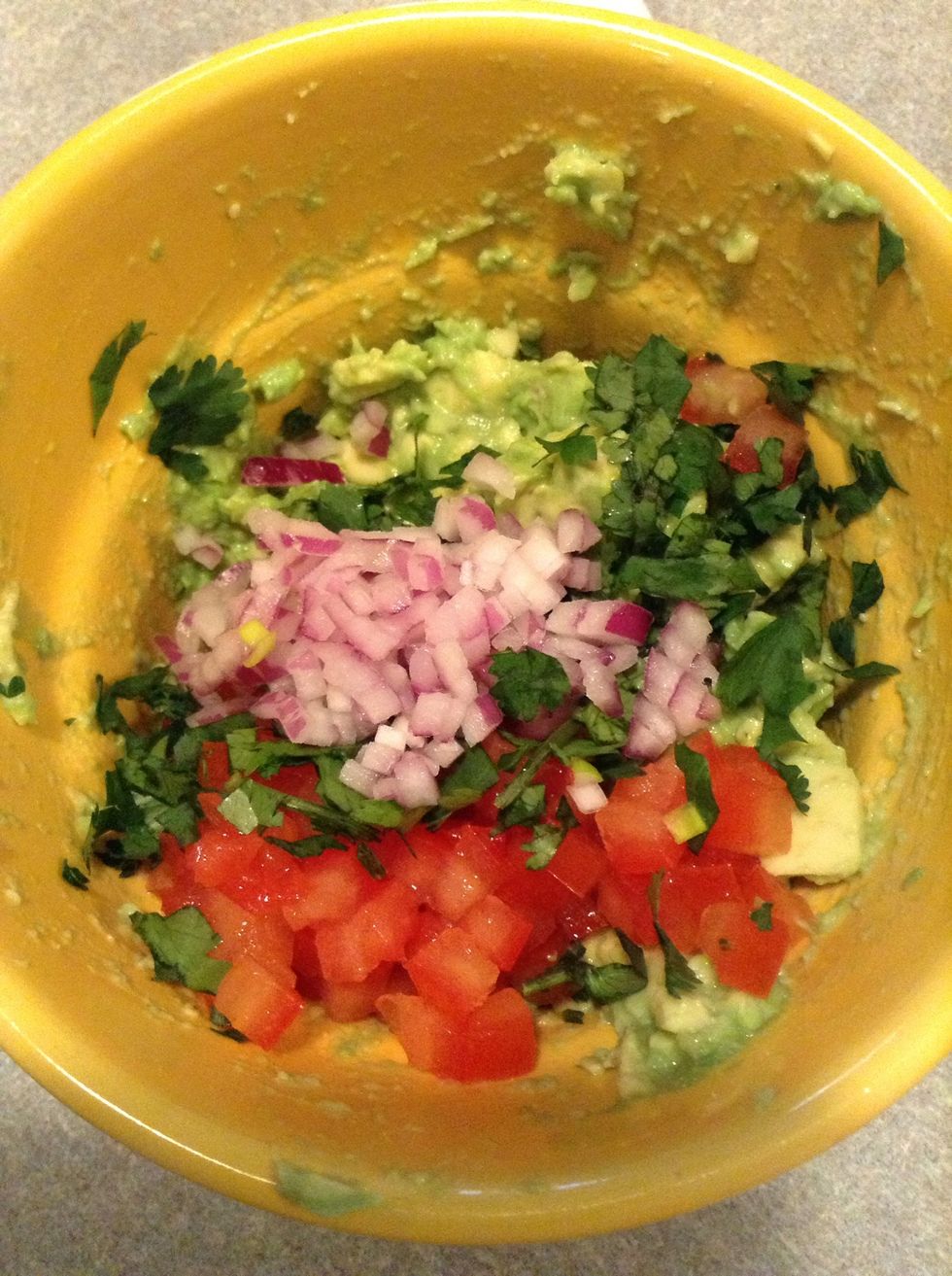 Add onion, tomato, and cilantro. Stir together.