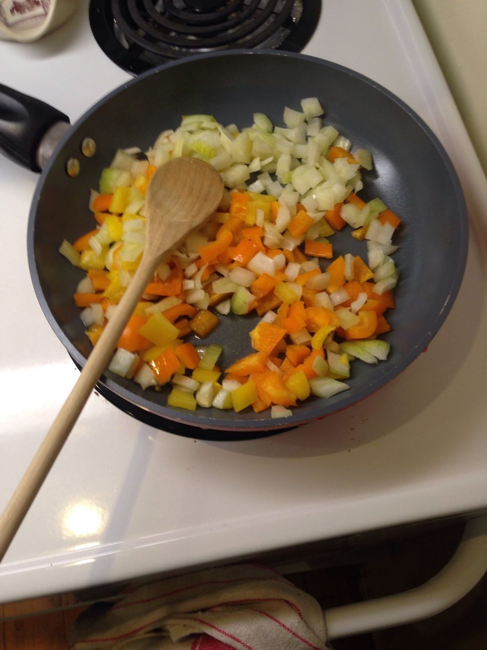 Add onions and peppers. Fry until softened.