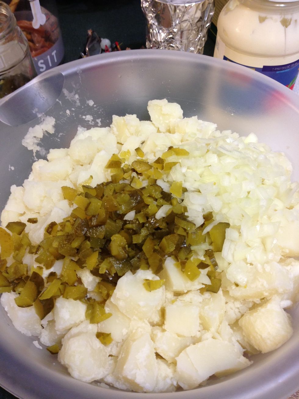Add onions and pickles and mix with potatoes. Next add mayo & mustard mixture, mix all together